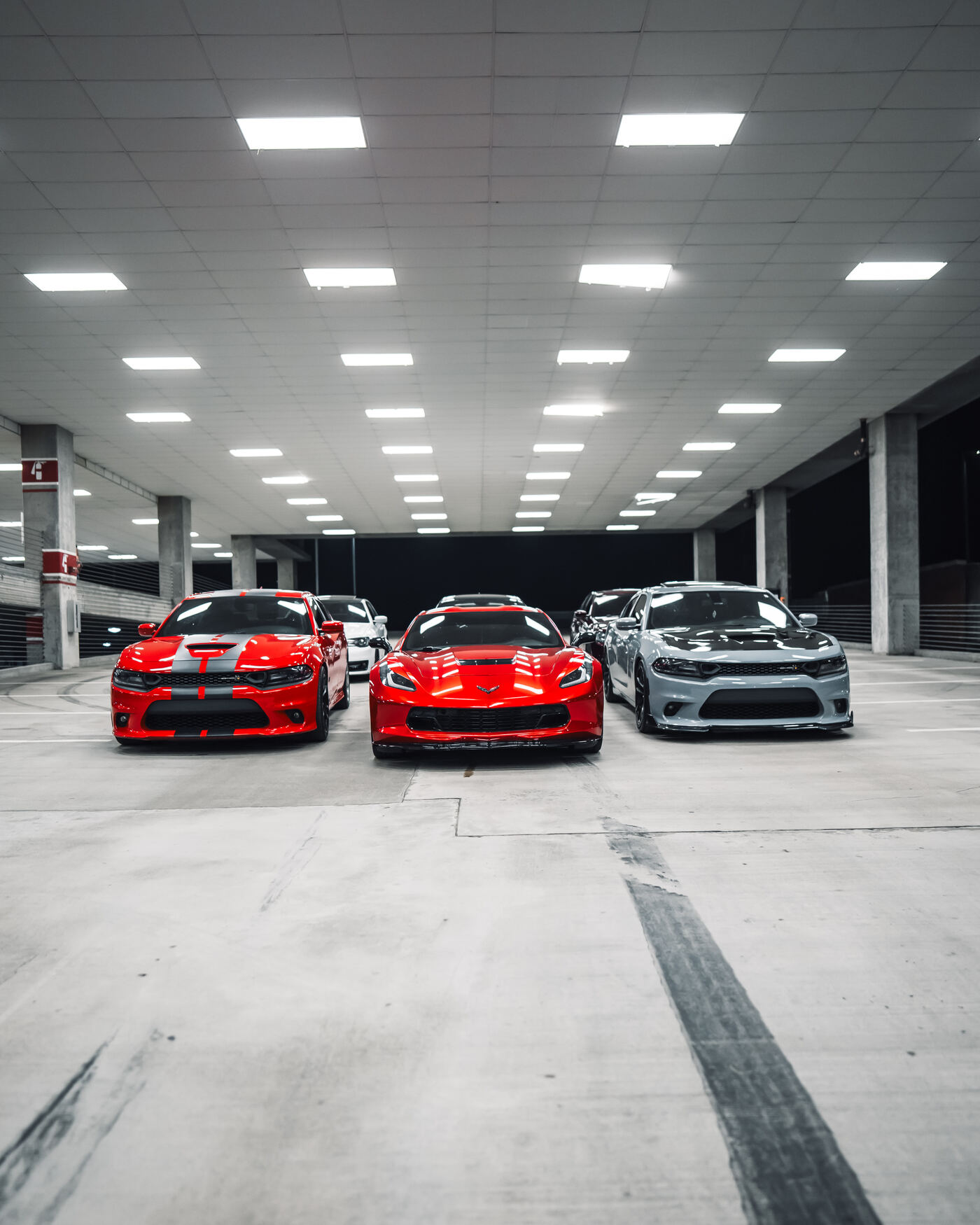 Three detailed Traviesos cars lined up in parking deck