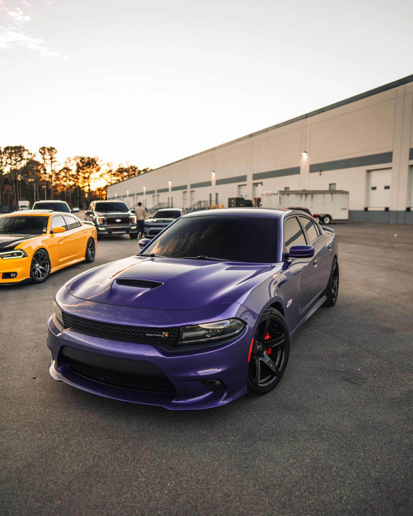 Purple Dodge Charger Scat Pack at sunset warehouse
