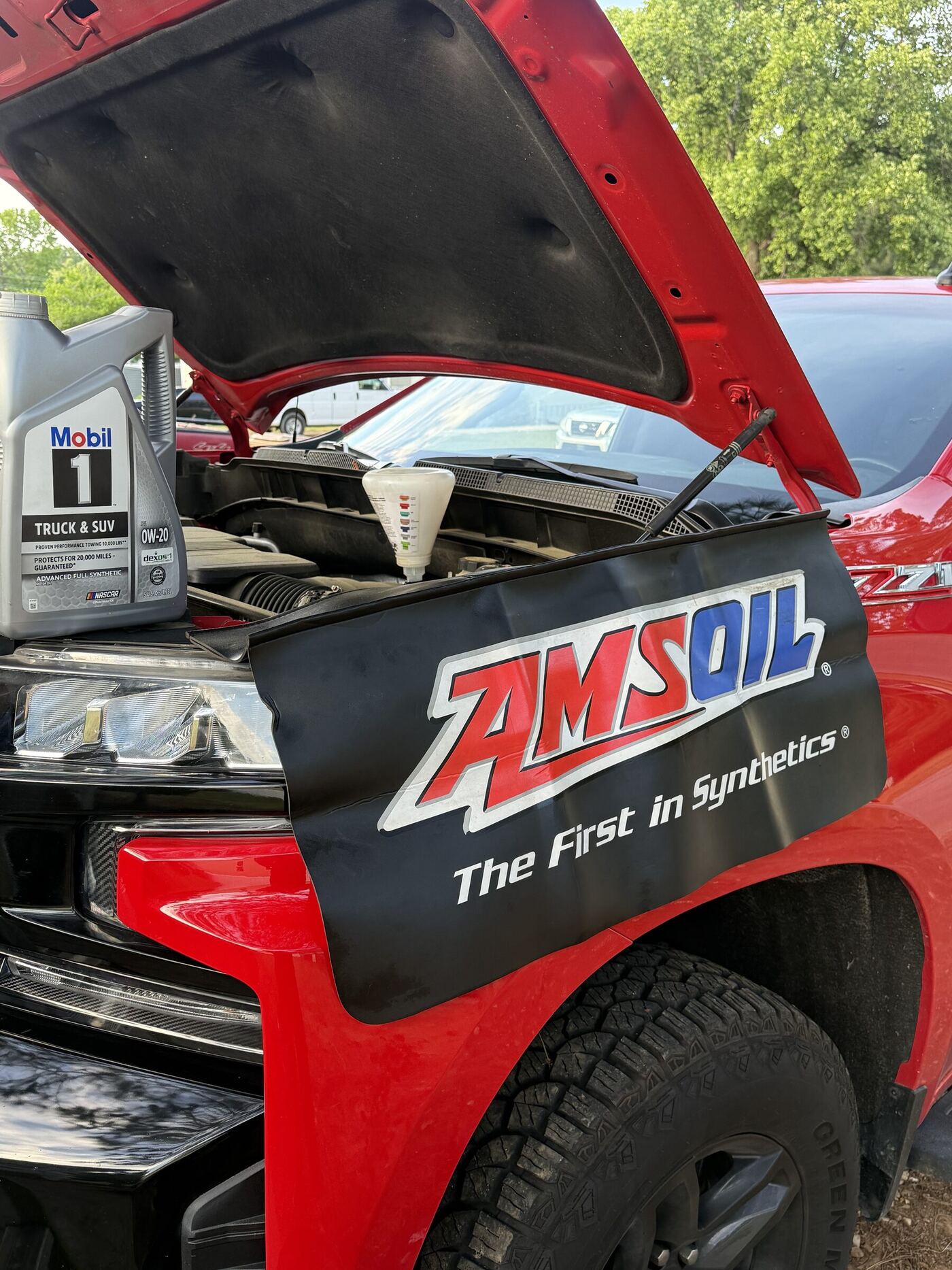 Mobile oil change service on red truck